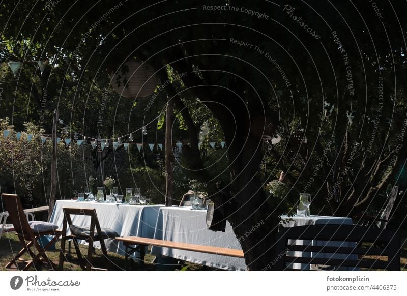 festively set tables between trees Feasts & Celebrations food and drink Outdoors Garden Garden festival Beer table flag Decoration celebrations at the same time