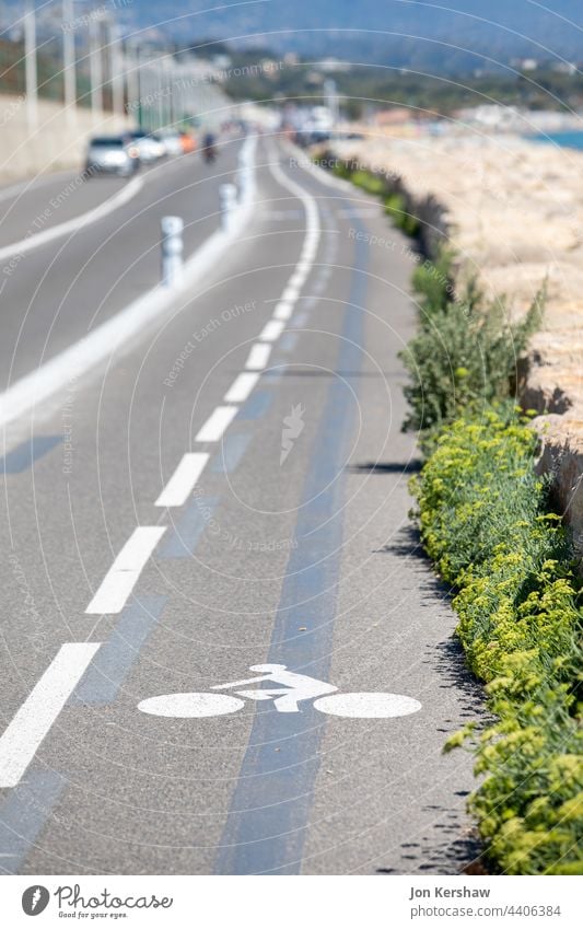 Cycle path sign on a coast road in the south of France bikeway cycle trafic sign road marking street sign cycle path pathway ground lane symbol indication