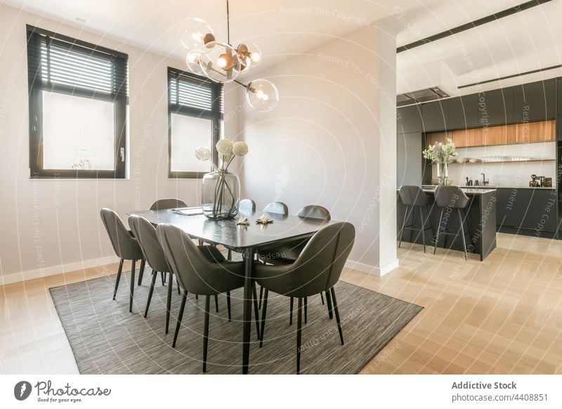 Interior of dining room in modern flat interior minimal style black furniture design contemporary simple apartment table chair residential dwell spacious light