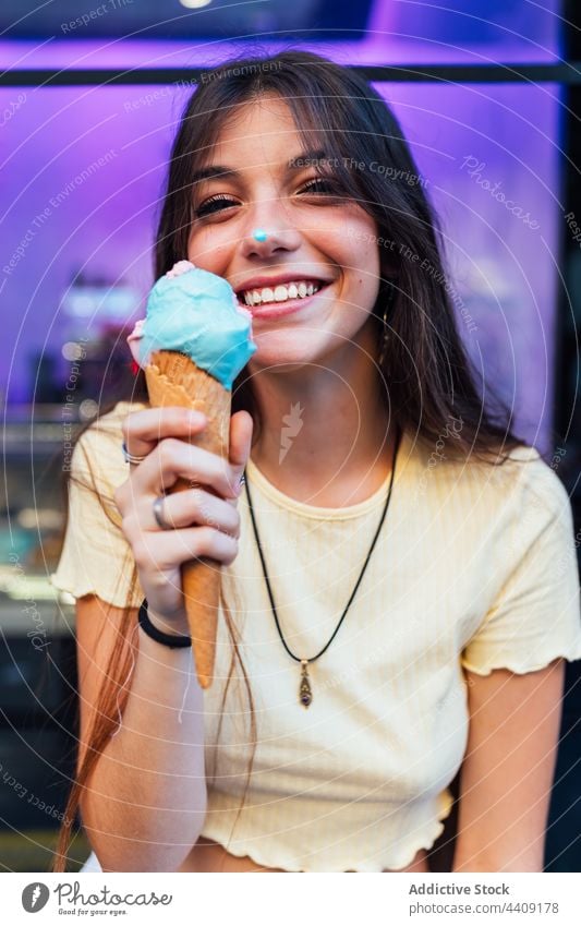 Crop happy woman with tasty ice cream cone in town smile dessert treat sweet portrait waffle delicious street crunchy gelato flavor yummy smooth creamy dairy