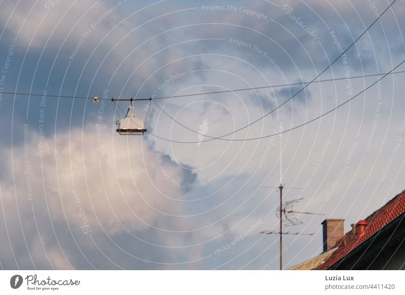 over the roofs street lights and wild sky street lamp streetlamp Cable Sky Street lighting Lantern Lamp Light Lighting Exterior shot Blue Clouds Electricity