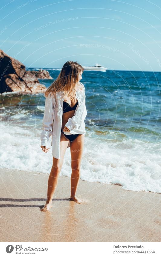 Portrait of a young woman on a beach day attractive back background beautiful beauty blue bride brunette coast cute dress elegant fashion female freedom girl