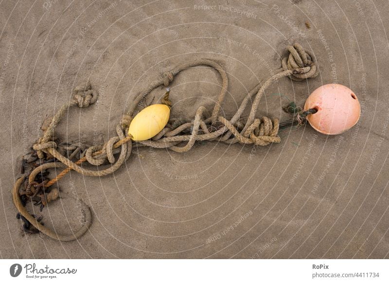 Anchor rope with floats on the beach. Beach coast Ocean sea ocean Sandy beach trace Feet foot footprint vacation coastal migration Relaxation tranquillity