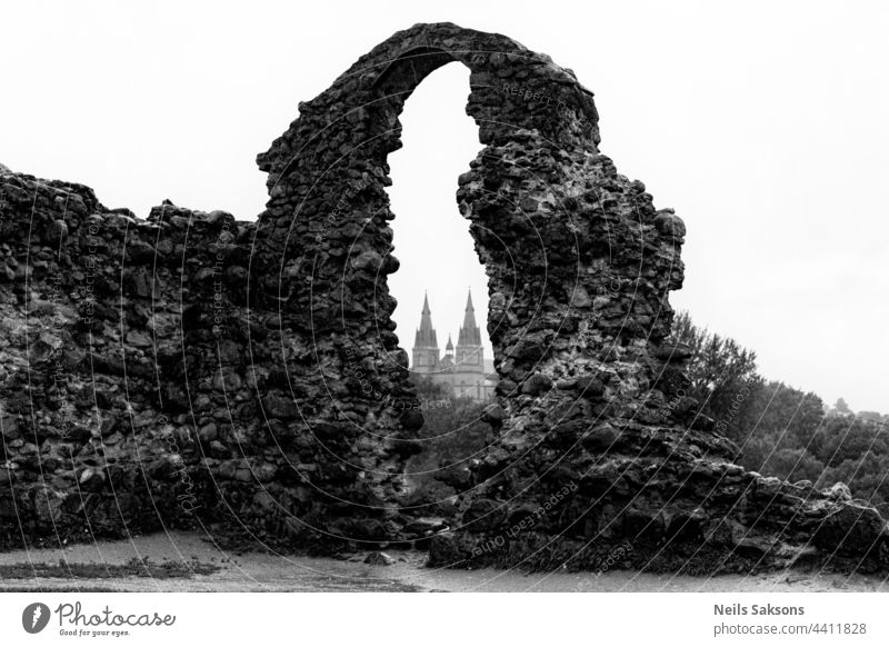 walking around in some dark rainy august day castle ruins church catholic Rezekne Latvia stone wall old castle medieval german tourism monochrome Bad weather