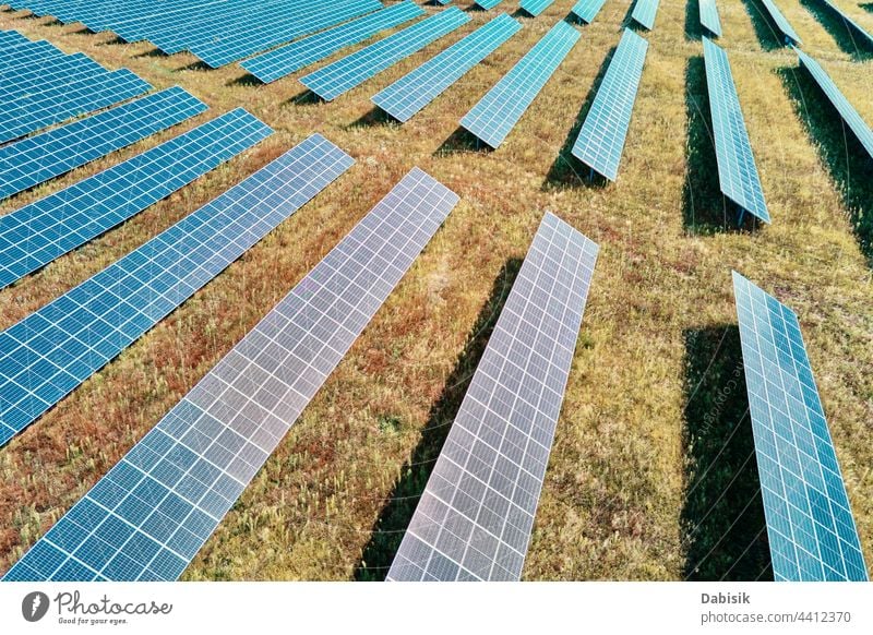 Solar panels farm in the field solar battery energy power sun alternative sustainable renewable plant photovoltaic ecosystem environmental green industry aerial