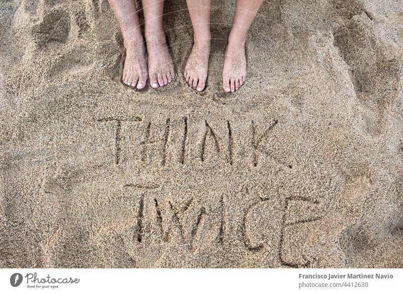 top view with copy space of feet of the woman in the sand of the beach with written text legs young sea seashore women relax travel vacation pedicure pretty