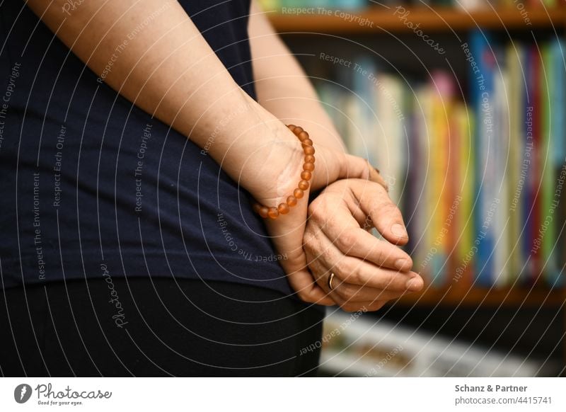 Hands clasped behind back hands Bracelet Jewellery Wait Bookshelf Wedding band Fingers To hold on slack