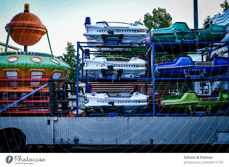 Fairground carousel on trailer funfair Showman Carousel Merry-go-round spaceship Starships Aircraft enlarge ride fairground In transit Loaded superstructure