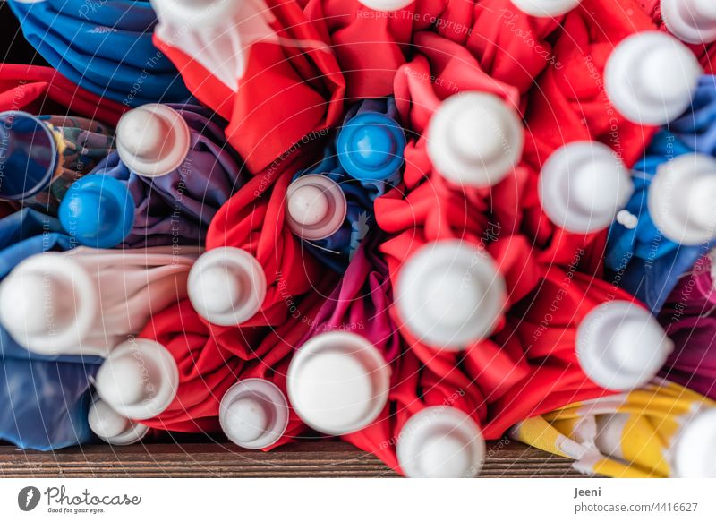 Order in chaos | many parasols stuck together variegated colourful Play of colours colors Arrangement havoc Orderliness Chaos sun protection stacked Summer