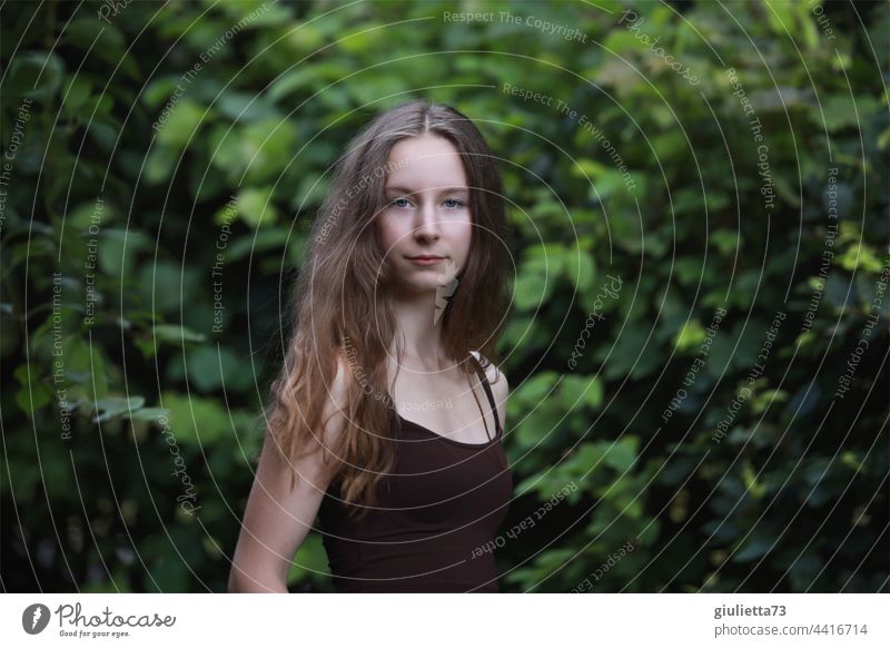 Summer portrait of long haired confident teen girl, natural beauty Colour photo Looking into the camera Exterior shot 13 - 18 years 15 16 16 years