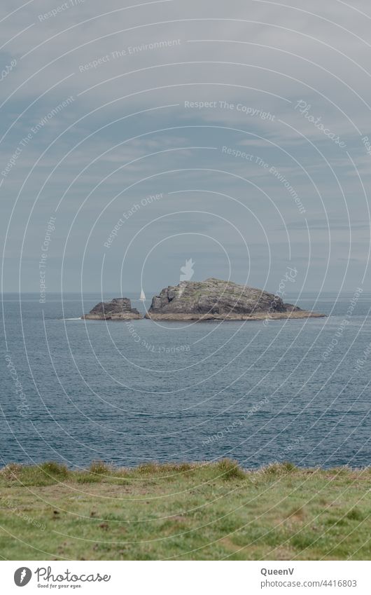 Sailboat between two stone islands at the sea Stone Island Ocean Atlantic Ocean Marola Galicia Oleiros Wild Water coast Sky Vacation & Travel Waves Landscape