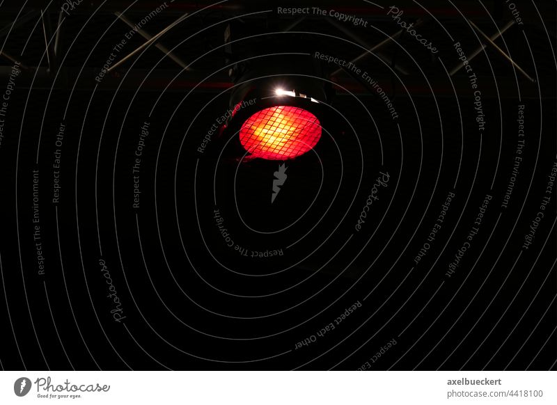 black background with stage lighting spotlight Floodlight Stage lighting Lighting Red Black dark background Copy Space Shows Event Concert Artificial light