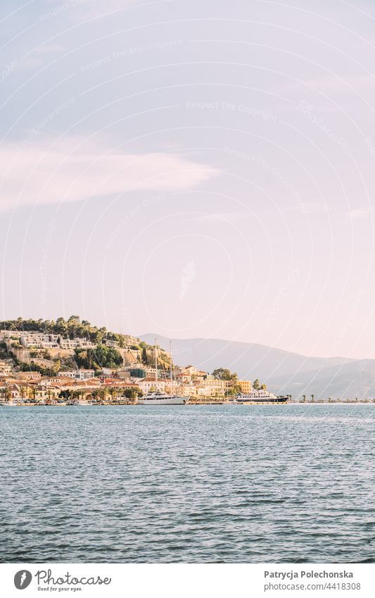 Nafplio town by the sea in Greece at sunset nafplio naufplion Sunset seaside Mediterranean sea boats Summer