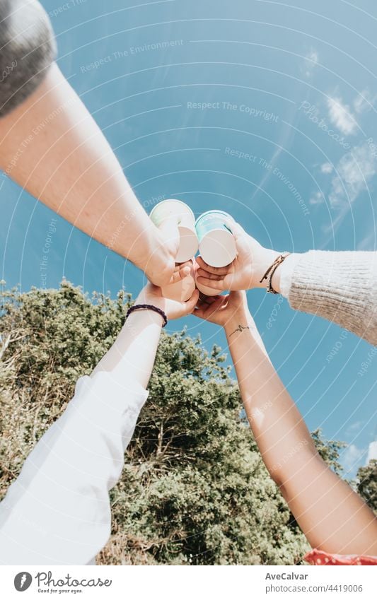 Group of happy friends drinking beer outdoors together - concept of friendship and celebration party happiness people group having joy photo youth sand