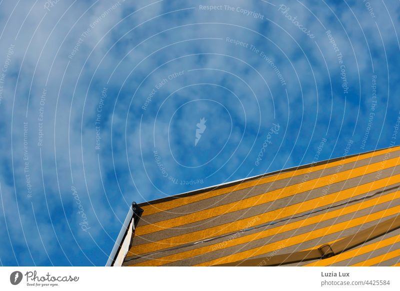 Yellow-grey striped awning, sunshine, blue sky with light clouds Sky Blue sky Clouds white clouds Summer Sun Sunlight sunny Summery Striped Gray Above