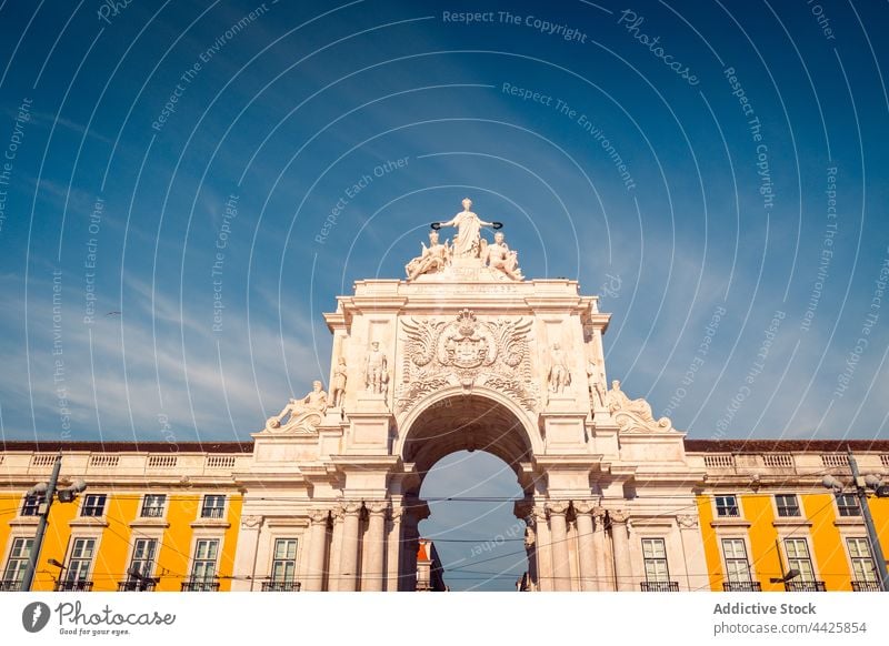 Triumphal arch against cloudy blue sky triumphal architecture famous building exterior square landmark lisbon portugal praca do comercio rua augusta arch europe