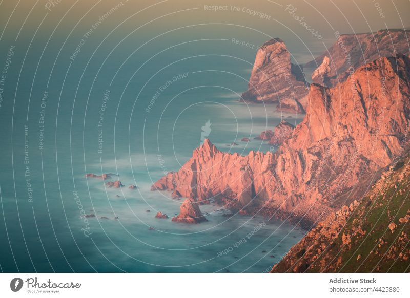 Waving sea near cliffs in morning sunrise wave rock splash weather water peaceful lisbon portugal cape roca sintra cascais natural park cabo da roca stone