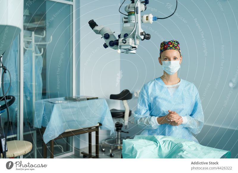 Surgeon in medical uniform working in operating room woman surgeon mask profession portrait specialist sterile nurse clinic doctor surgical hospital