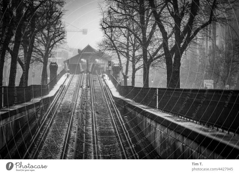 Schönhauser Allee elevated railway in driving snow Mono rail Prenzlauer Berg blow snow b/w Berlin Downtown Capital city Exterior shot Town Old town Deserted