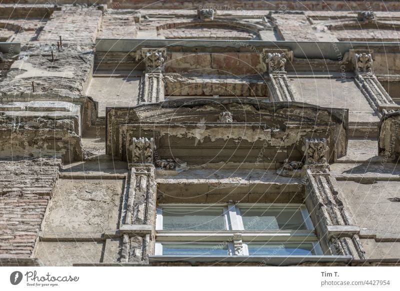 View upwards at an old facade with windows in Berlin Facade Old building Window Prenzlauer Berg Town Downtown Capital city Deserted Old town