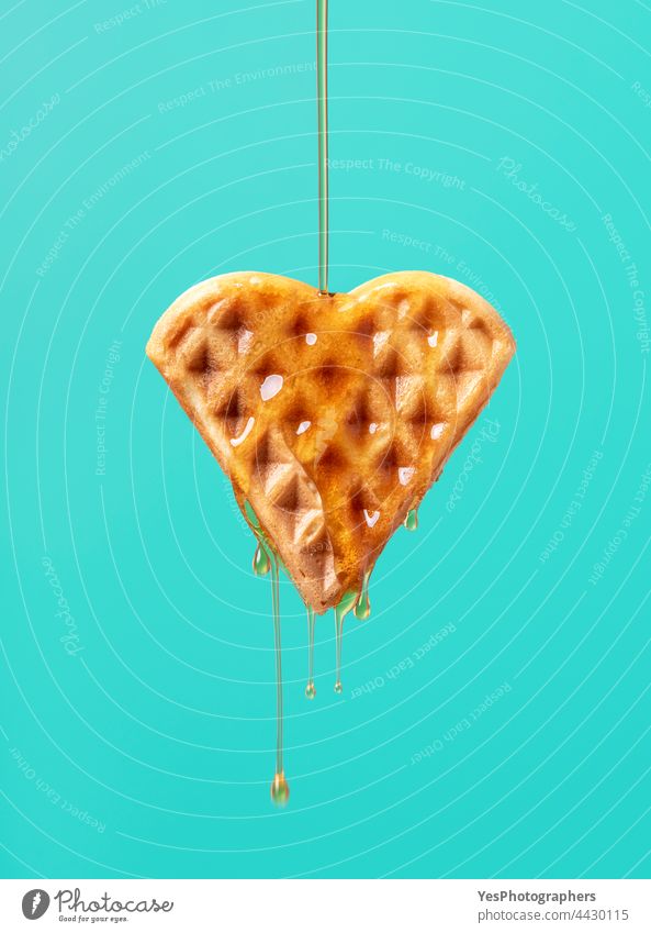 Waffle with maple syrup isolated on a green background. baked belgian breakfast brown cake calories caramel close-up color copy space cut out delicious dessert