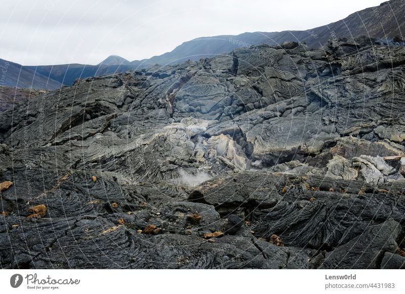 Lava field of Iceland's newest volcano, Geldingadalir black geldingadalir hot iceland icelandic landscape lava magma rock scenery smoke stone tectonic volcanic