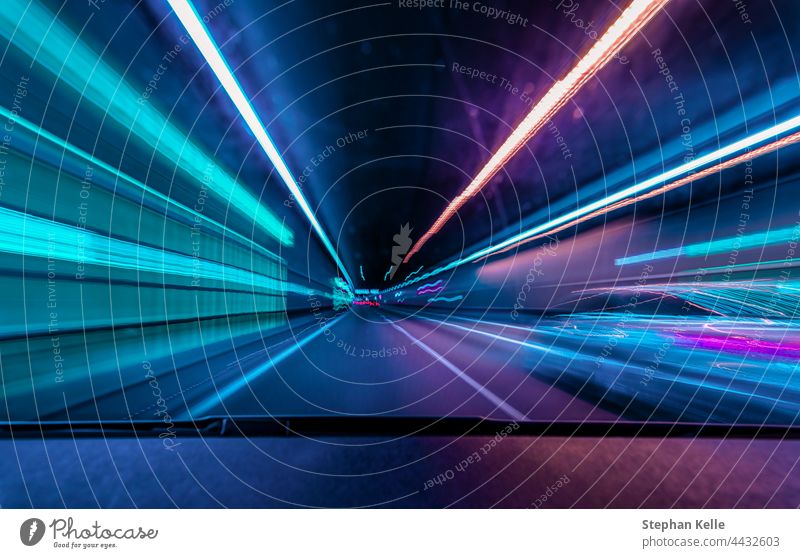 Highspeed underground drive - colorful concept for racing through the night and overtaking another car in a tunnel with motion blur effect. High speed