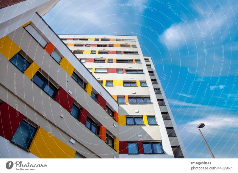 Facade of urban apartments. Urban apartment complex. Detail facade of multi-storey residential building. Apartment building, new architecture, residential building.