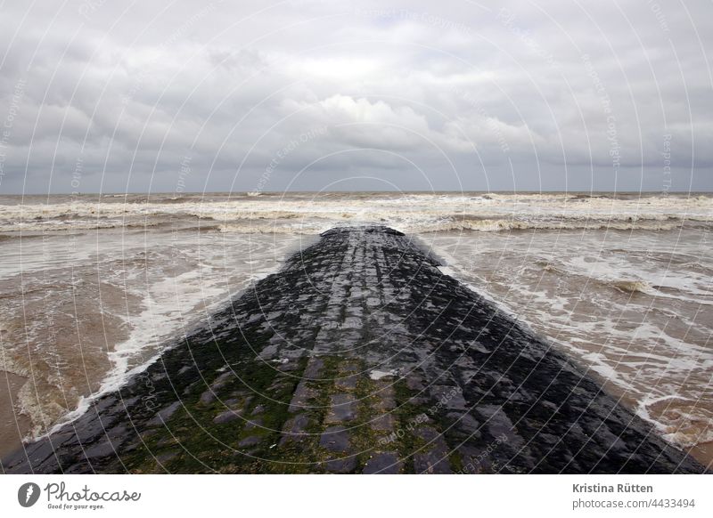 path to the sea Break water North Sea Ocean Lake breakwater Dam Waves Beach Sky Clouds Water off Footbridge Wind cloudy Horizon coast Landscape Nature Weather