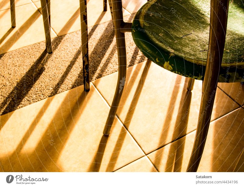 Rusty and old tables and chairs in the cafeteria rusty empty background light shadow people blur indoor college school university plastic steel furniture seat