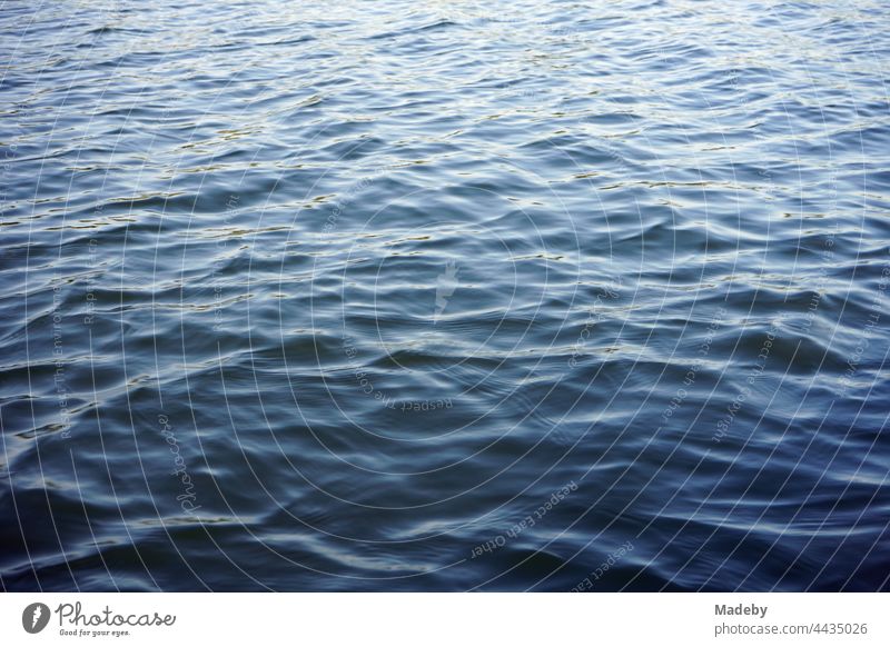 Light waves on the dark blue water surface of the Poyrazlar Gölü near Adapazari in summer sunshine in the province of Sakarya in Turkey Water Lake Water surface