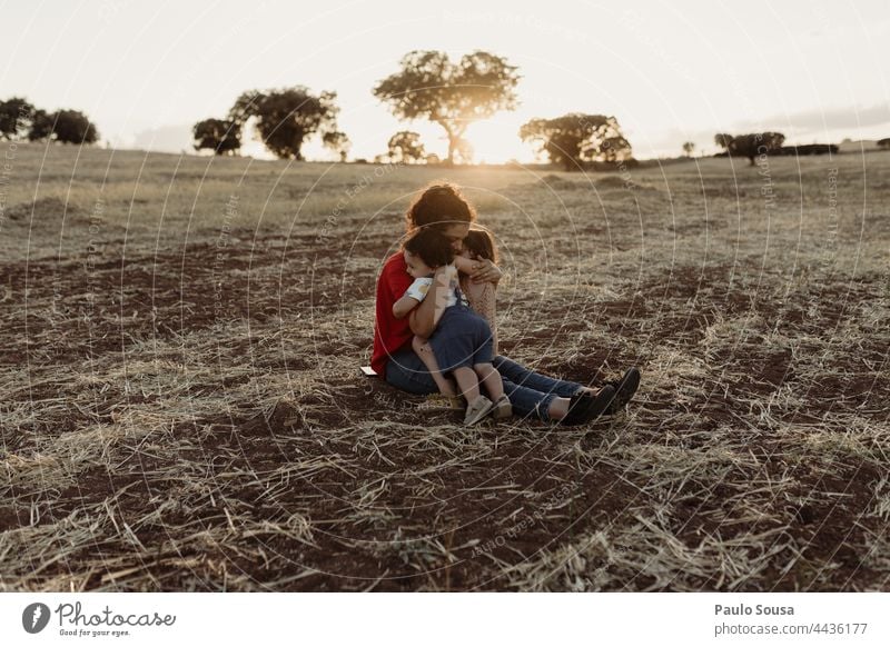 Mother with children in the fields Mother's Day motherhood Child Brothers and sisters Family & Relations Together togetherness Authentic Love Cute Caucasian