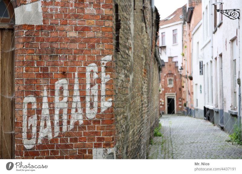 AltstadtGarage Architecture Building Facade Wall (barrier) Wall (building) Lettering Alley Town Characters Narrow Street Old town Lanes & trails