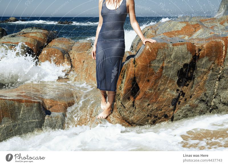 A perfect vacation postcard from Portugal, Porto. Endless blue ocean, angry waves, and rocky shore accompanied by a gorgeous woman in a wet t-shirt. This must be a perfect place to stay for the holidays.