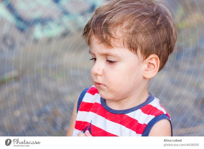 Portrait of a little boy making a strange face. child isolated portrait screaming one people terrified background beautiful beauty behavior blonde blue