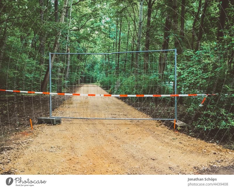 Dead end road End of road Fence Barrier in front of forest road No through road cordon Nature Footpath Red White rail ending trees Environment stop