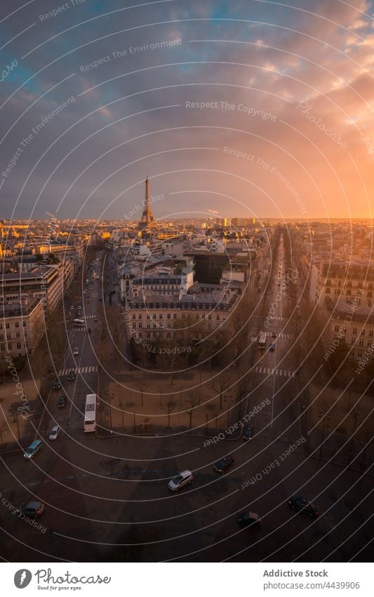 Cityscape with roads and buildings under sunset sky cityscape cloudy architecture route shiny direction evening facade residential glow colorful remote height