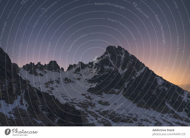 Snowy mountains under starry sky at night snow nature highland landscape astronomy galaxy space cosmos universe geology dark dusk twilight evening ridge rugged