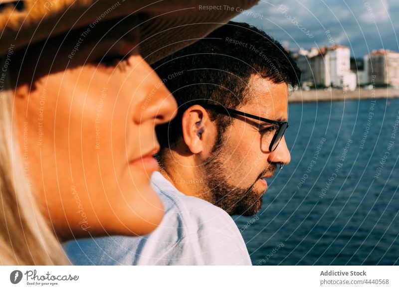 Crop couple of travelers admiring sea on sunny day admire tourism vacation trip natural reflective idyllic harmony spend time saint jean de luz france