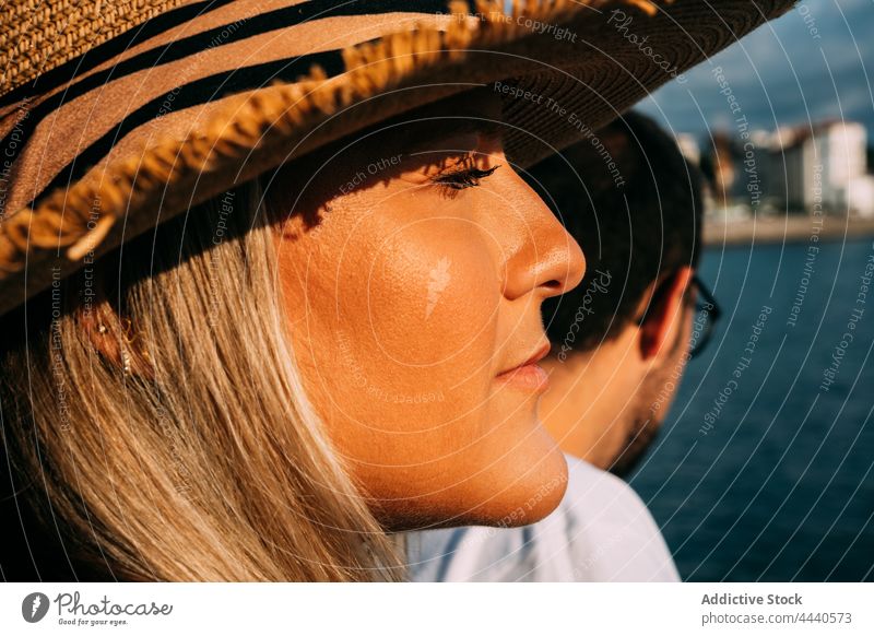 Crop couple of travelers admiring sea on sunny day admire tourism vacation trip natural reflective idyllic harmony spend time saint jean de luz france