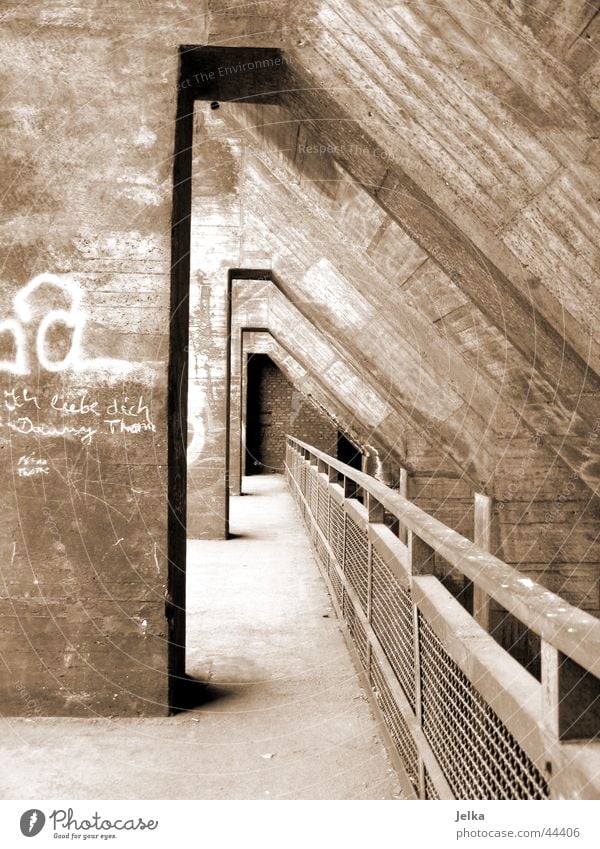 tunnel vision Industrial plant Factory Tunnel Manmade structures Architecture Concrete Brown Handrail Black & white photo Exterior shot Deserted