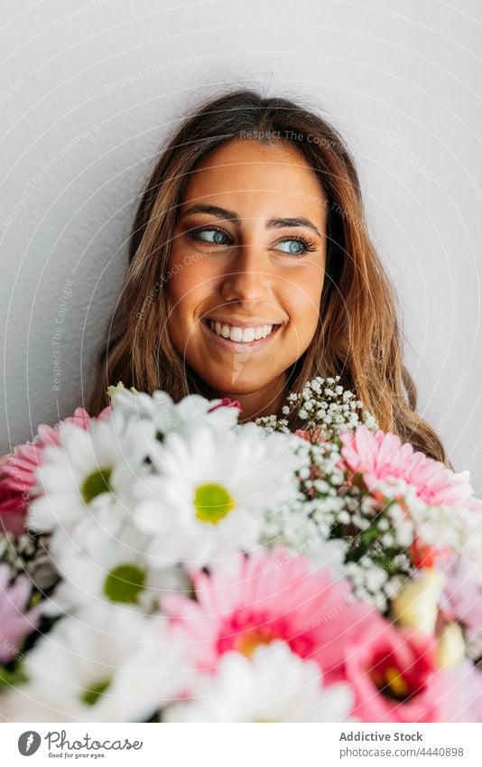 Stylish teen girl with flowers bouquet cute beauty teenager female fashion young pretty person hair portrait white style beautiful woman elegant people