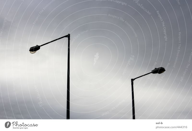 nightfall Sky Clouds Town Dark Tall Cold Above Gloomy Moody Sadness Street Street lighting Street lamp Argument Disagreement Opposite Urbanization Lighting