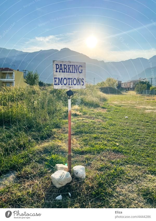 Parking Emotions is written on a sign in the landscape emotionally Landscape unfeeling Signage surreal Sun tranquillity stoic Rational Parking lot