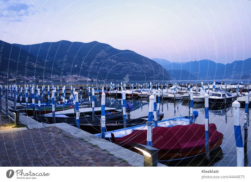 Quiet rests the lake and the boats in the dusk mountain lake Excursion boats Water Landscape Nature Mountain Lake Exterior shot Alps Lakeside Beautiful weather