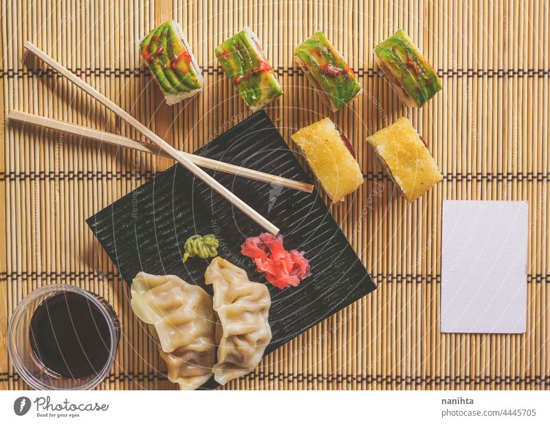 Fushion food of modern california roll and gyoza sushi japanese fusion avocado delicious soy soy sauce bamboo sushi mat rice recipe take away take away food