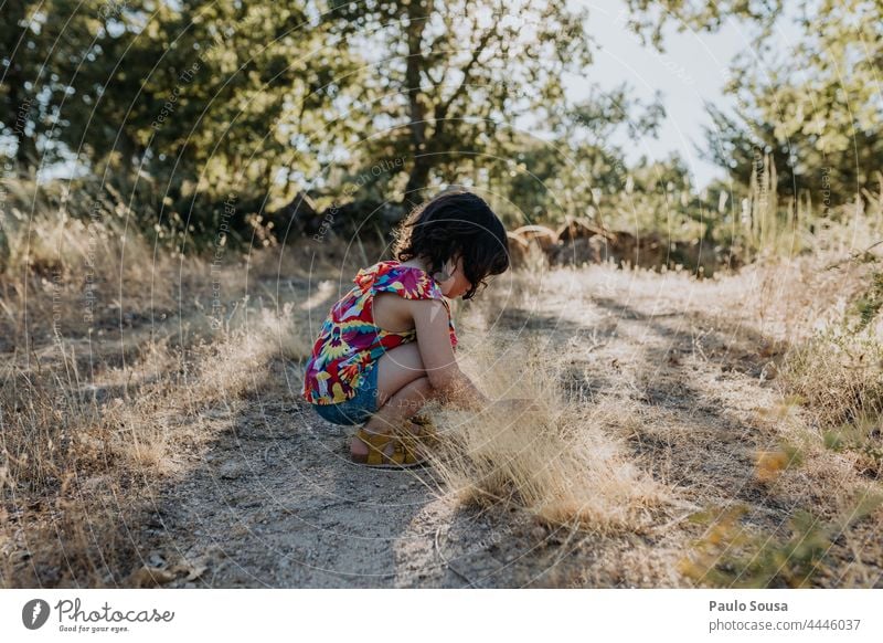 Cute girl picking wild flowers Girl 3 - 8 years Caucasian Child childhood Flower Nature Authentic Summer Summer vacation travel holiday Happy