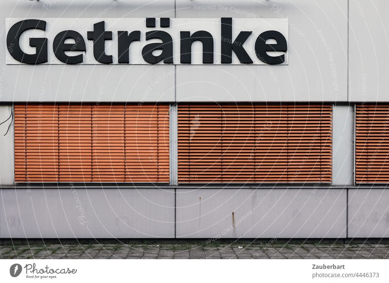 Drinks inscription on building with concrete wall with orange blinds drink Building Concrete Closed Orange Wall (building) Concrete wall Wall (barrier) Facade