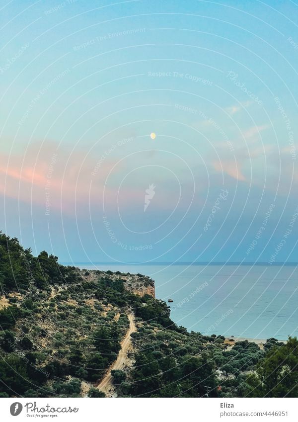 Coast with pink clouds and moon against blue evening sky coast Moon Blue Sky Ocean Pink Clouds atmospheric Twilight Landscape Horizon Deserted Lonely Water