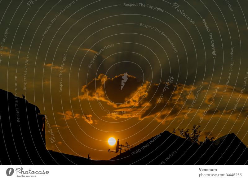 Sunset over the roofs of the city Cloud Clouds Nature Sky Evening Color phenomenology House Houses sunset sundown setting of the sun